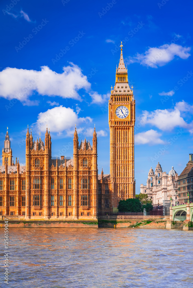 London, United Kingdom. Big Ben and Parliament Building on Thames riverbank.