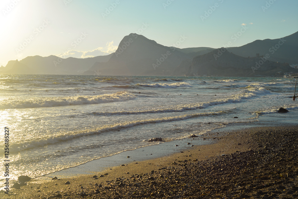 Background landscape view of Sudak Bay, the city of Sudak and its embankment in Crimea