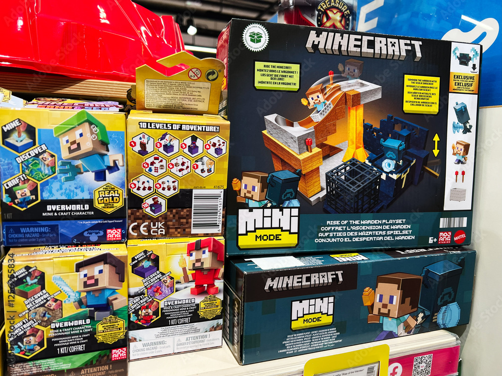 Naklejka premium Kyiv, Ukraine - February 09, 2025: Colorful display of Minecraft mini mode playsets with character toy packaging