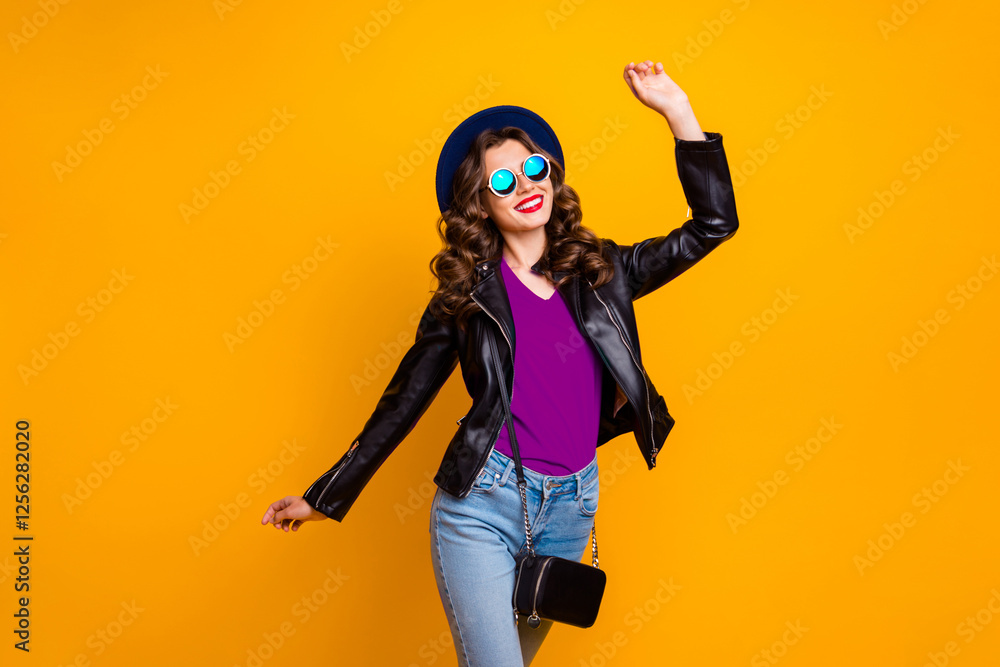 Obraz premium Photo of attractive lady walking down shopping center overjoyed by spring warm weather wear stylish outfit with shoulder clutch isolated yellow background
