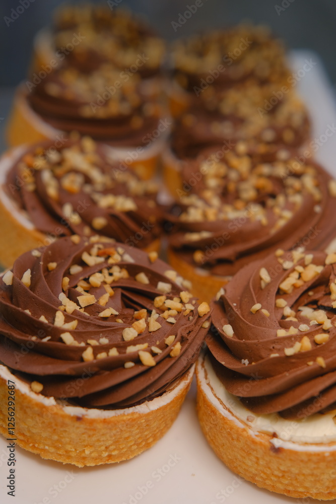 chocolate tart crushed peanut topping in buttery shortcrust pastry basket on white plate placed on counter perfect for dessert lovers indulgent treat rich texture sweet pastry close up festive chocolate tart crushed peanut topping in buttery shortcrust pastry basket on white plate placed on counter perfect for dessert lovers indulgent treat rich texture sweet pastry close up festive