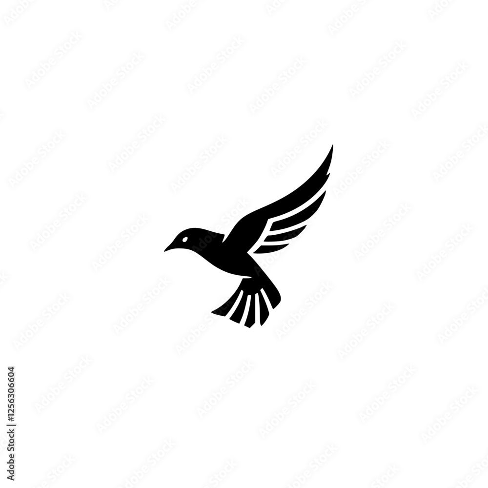Obraz premium Black silhouette of a bird in flight against a white background.