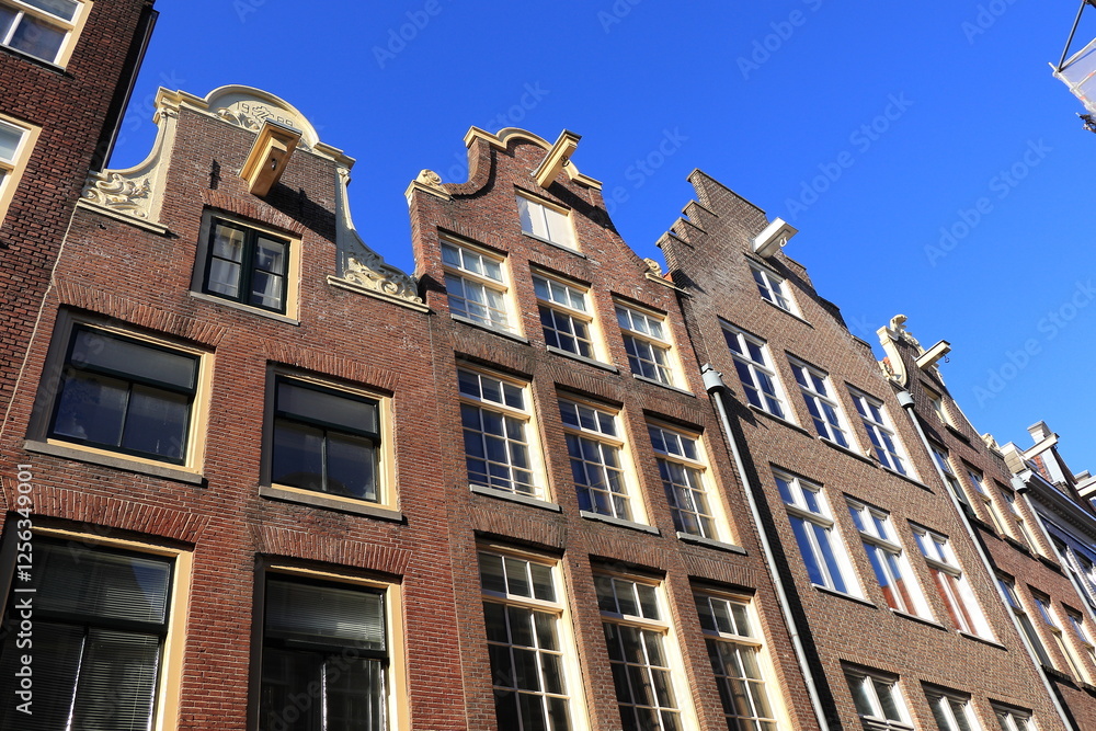 Fototapeta premium Amsterdam Zeedijk Brick House Facades with Blue Sky, Netherlands