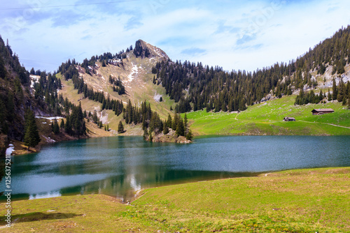 View of the Lake Hinterstocken at the foot of Stockhorn peak in Bernese Oberland, Switzerland photo