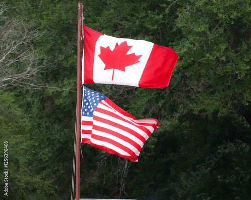Canadian And American Flags Flying Proudly At The Saskatchewan International Raceway, Saskatoon Dist., Saskatchewan August 17, 2024