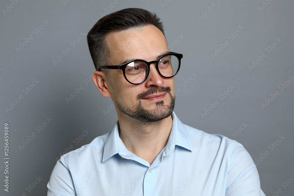 Portrait of handsome middle aged man on grey background Portrait of handsome middle aged man on grey background