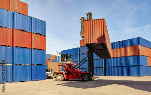 A forklift in a warehouse containing transport equipment and cargo containers