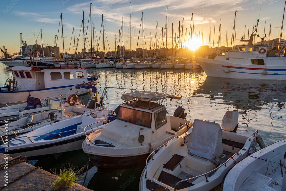 beautiful scene at a harbor during sunset.