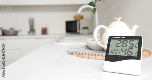 Photos Digital hygrometer on counter in kitchen, closeup