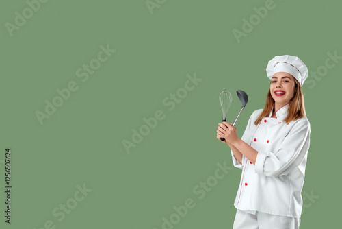 Young female chef with whis...