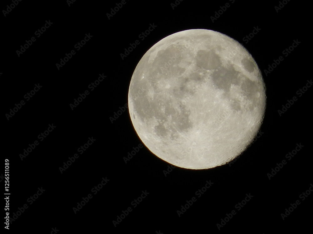 Detailed Full Moon Against a Black Night Sky. High-Resolution Lunar Photography Detailed Full Moon Against a Black Night Sky. High-Resolution Lunar Photography