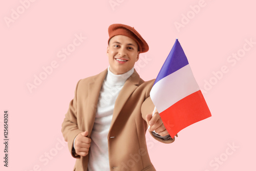 Young man in beret with fla...