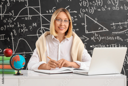 Mature female math teacher ...