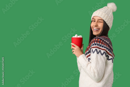 Happy young woman with cup ...