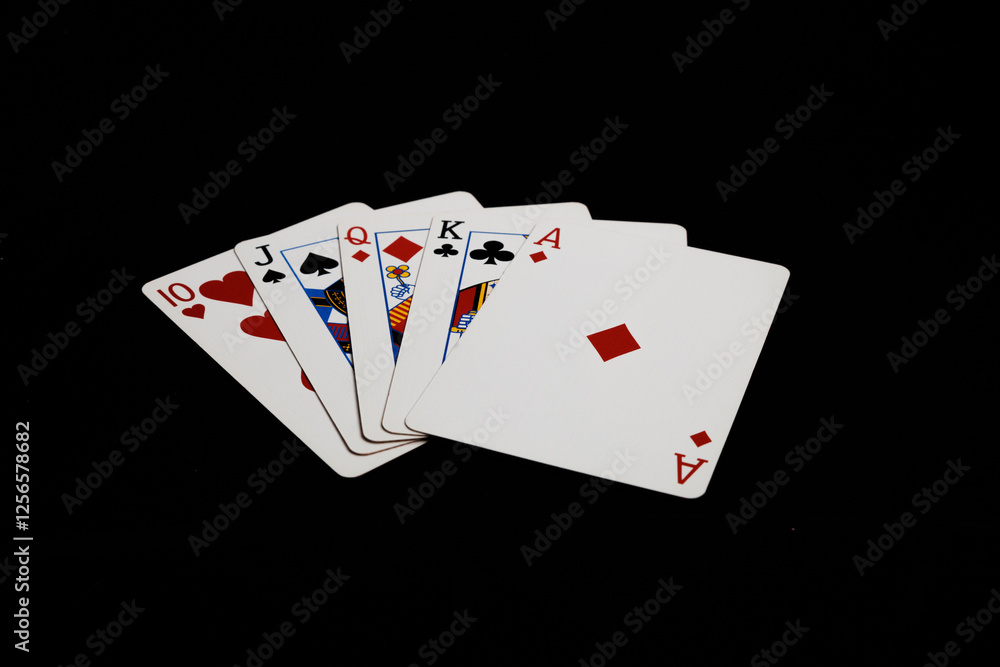 Obraz premium Straight in poker hand on a black background. Gambling card games.