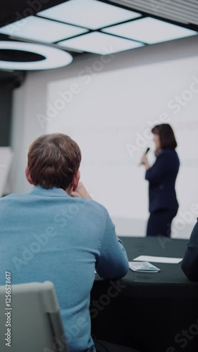 Business conference. The female speaker addresses the audience. Lecture.