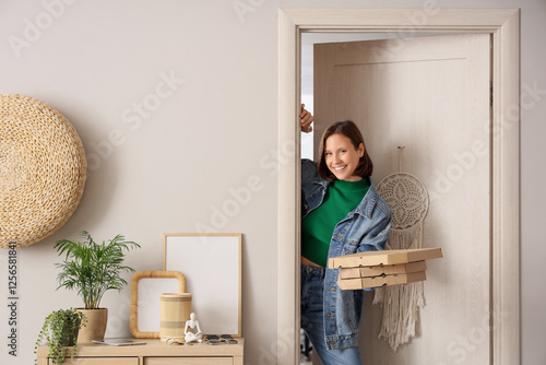 Young woman with pizza boxe...