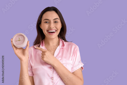 Young woman in pink pajamas...