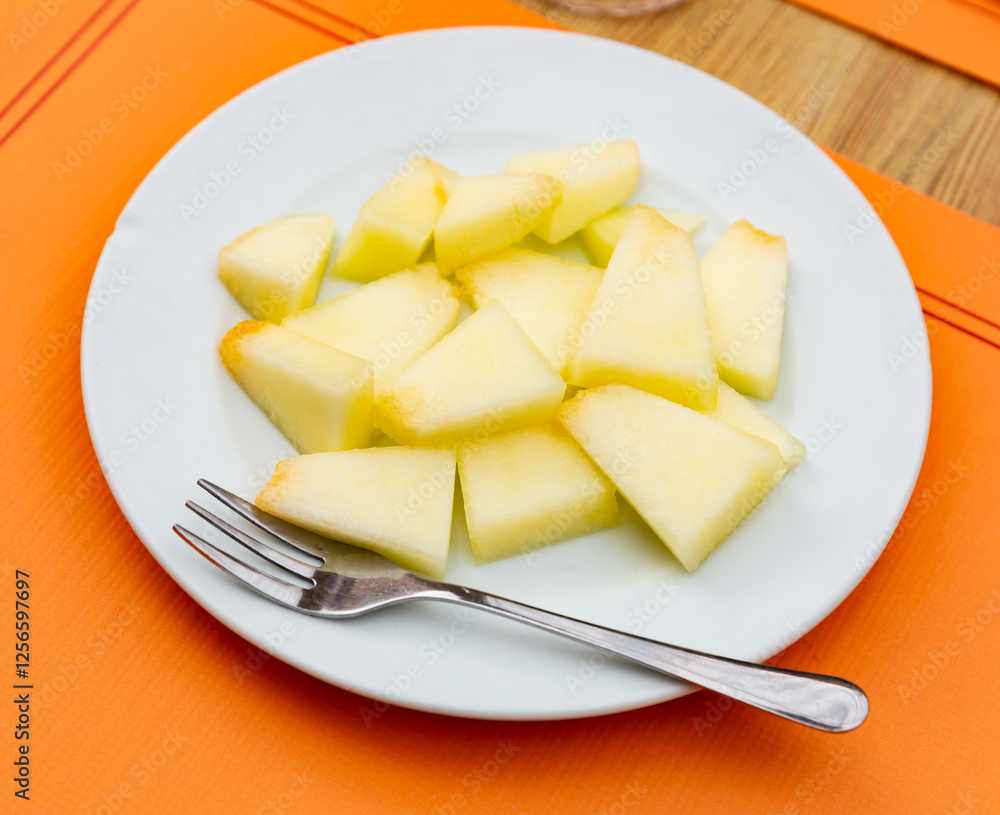Image of melon, sliced, tasty, beautiful presentation on plate Image of melon, sliced, tasty, beautiful presentation on plate
