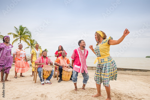 Beautiful Latina girl of the Garifuna ethnic group dances to the rhythm of the music.