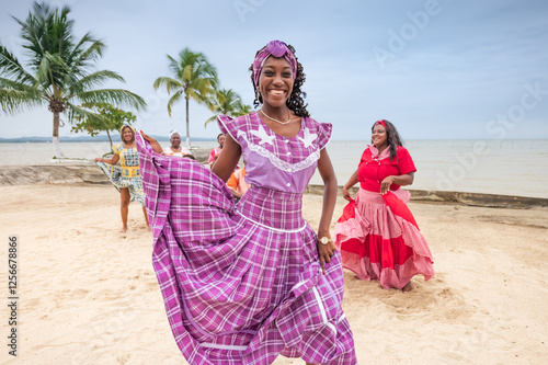 Portrait of a beautiful girl from the Garifuna ethnic group wearing a beautiful traditional costume in lilac color.