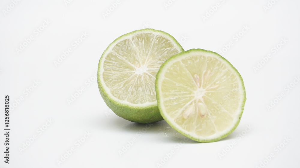 Half of Fresh Green Lime Isolated on White Background Half of Fresh Green Lime Isolated on White Background