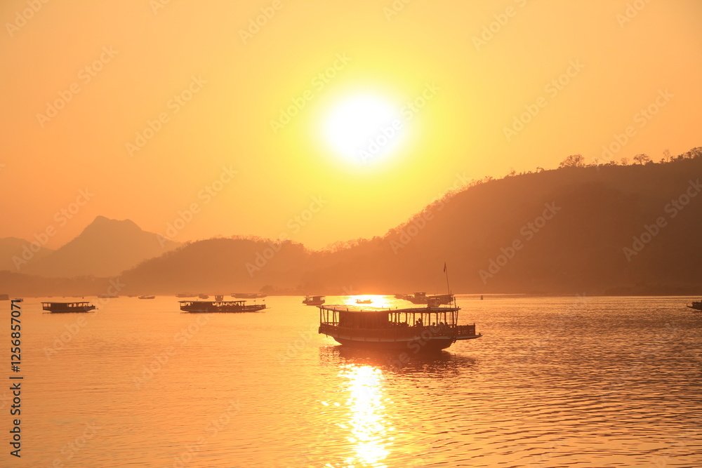 Sunset Boat Cruise on Nam Ou River in Luang Prabang, Laos Sunset Boat Cruise on Nam Ou River in Luang Prabang, Laos