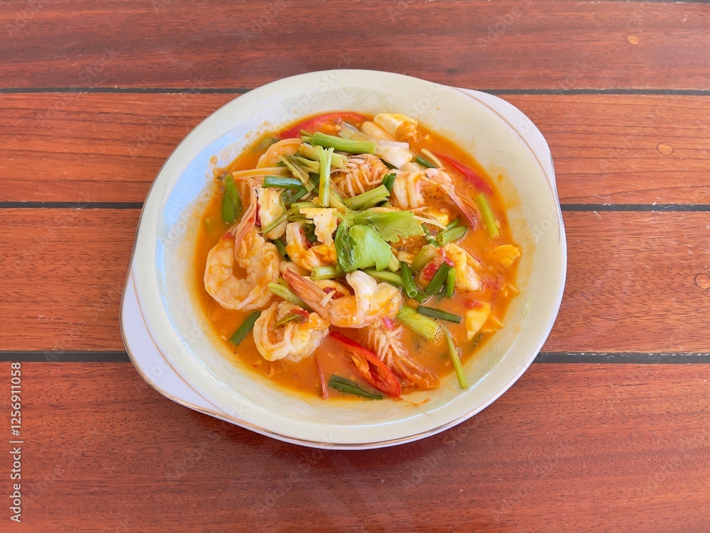 Stir fried shrimp with salted egg, famous delicious Thai food. Thai seafood recommend menu Stir fried shrimp with salted egg, famous delicious Thai food. Thai seafood recommend menu
