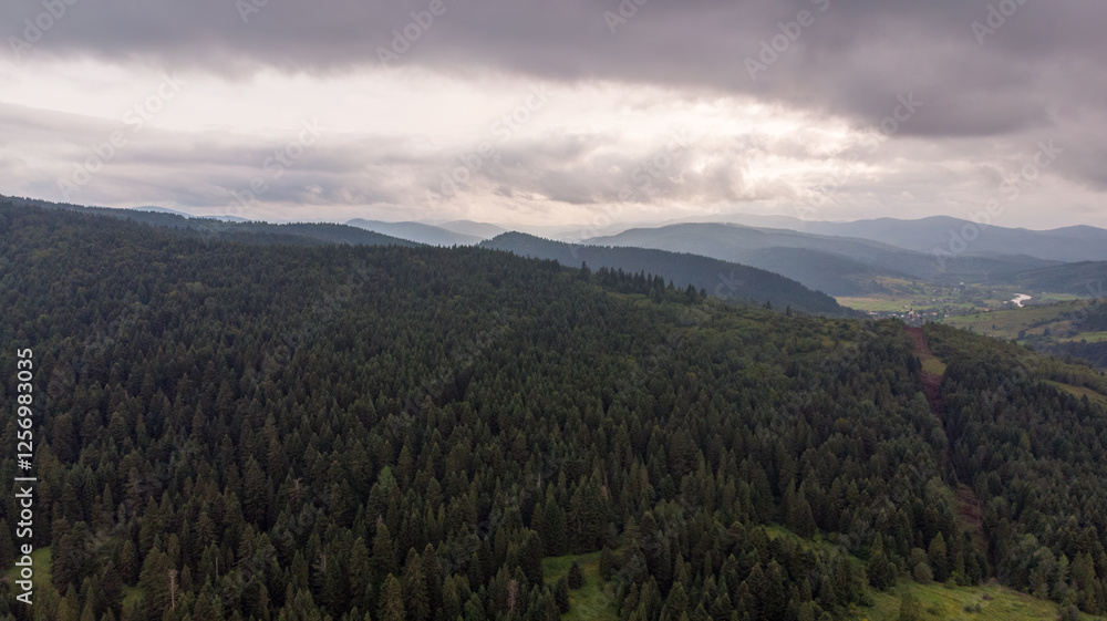 Majestic Mountains, Lush Green Forests, And Dramatic Clouds With The Sun Casting A Golden Glow. Aerial View Capturing The Stunning Beauty Of Nature From A Bird’s-Eye Perspective. Majestic Mountains, Lush Green Forests, And Dramatic Clouds With The Sun Casting A Golden Glow. Aerial View Capturing The Stunning Beauty Of Nature From A Bird’s-Eye Perspective.