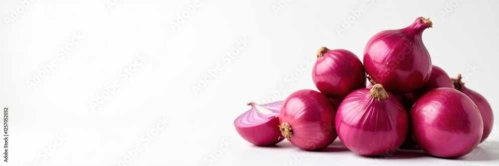 Many red onions stacked, textured skins, clean white backdrop, cooking, organic Many red onions stacked, textured skins, clean white backdrop, cooking, organic