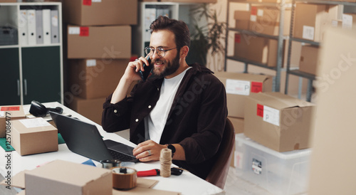 Tableau sur toile Happy businessman, laptop or logistics with phone call for online order or customer service at storage warehouse