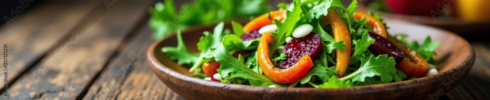 Fresh arugula salad with roasted beets and grilled peppers on a rustic wooden plate, vegetable salad, colorful dish Fresh arugula salad with roasted beets and grilled peppers on a rustic wooden plate, vegetable salad, colorful dish