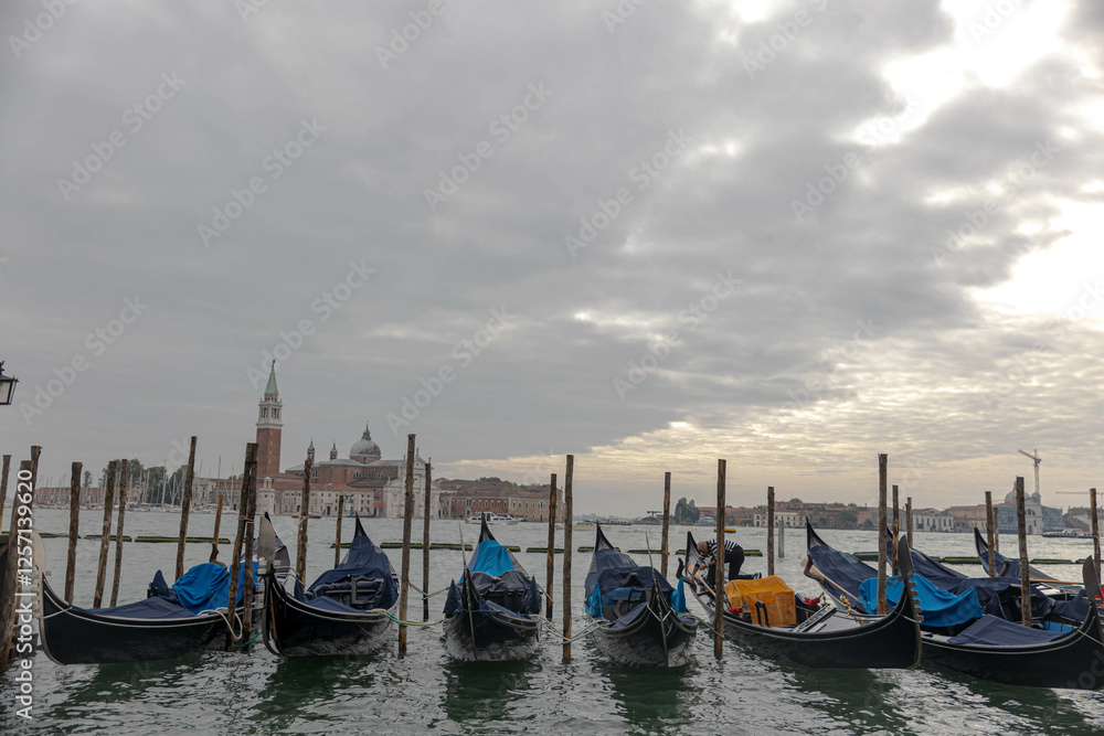 Gondolas lined up looking out onto Grand Canal, Venice Gondolas lined up looking out onto Grand Canal, Venice