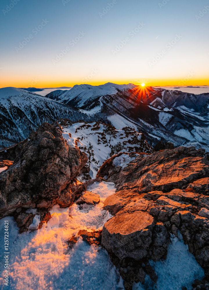 Fototapeta premium Winter hiking to Velky Rozsutec in Mala Fatra National park is full of beautiful views. Sunset in Slovakia mountains. Slovakia landscape