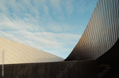 sloped architecture facade with blue sky photo