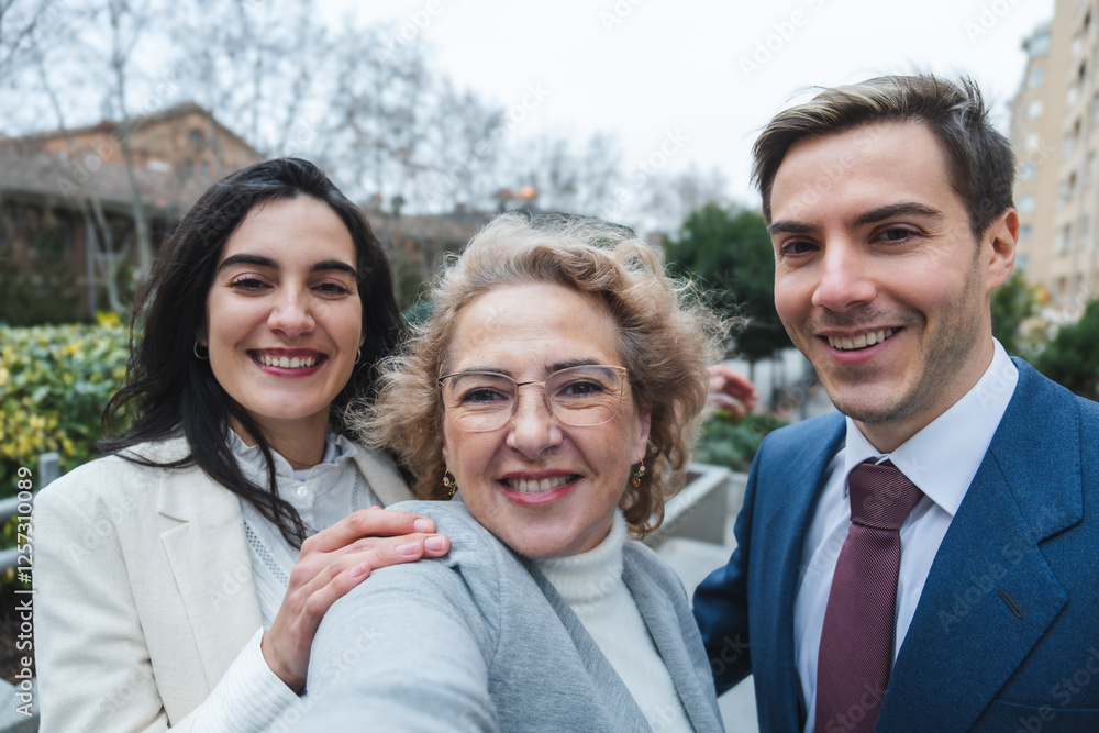 Happy business team smiling together outdoors in urban setting Happy business team smiling together outdoors in urban setting