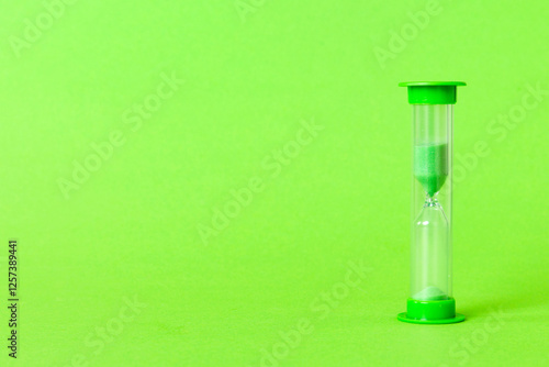 hourglass on the table, sand clock as time passing concept for business deadline, copy space