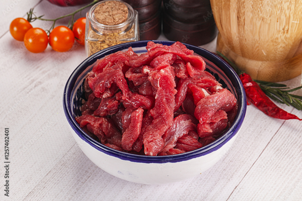 Raw beef meat - sliced strips Raw beef meat - sliced strips