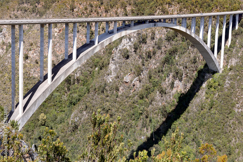 The Bloukrans Bridge is a single-span concrete road bridge in South Africa. It crosses the Bloukrans River, which divides the Eastern Cape (Kakadu district) and Western Cape (Eden district) provinces. photo