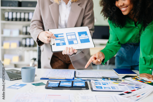 UX developer and ui designer brainstorming about mobile app interface wireframe design photo