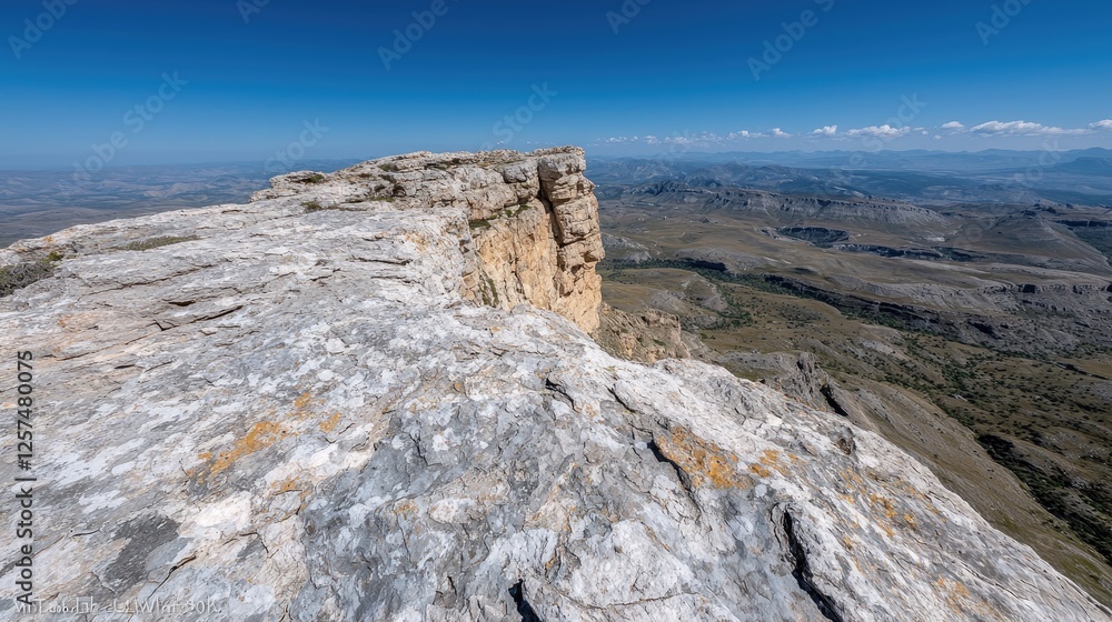 Fototapeta premium Mountaintop Vista, Rocky Cliff Face, Sunny Day