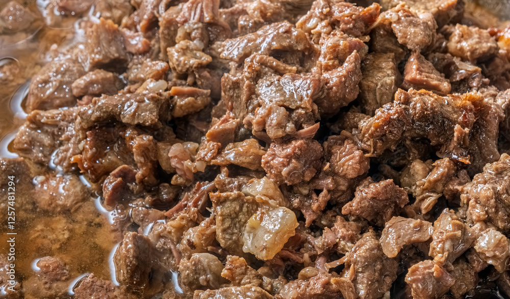 Traditional Turkish Braised Meat (Kavurma). The meat is simmered in its own fat, creating a deep, savory taste with a soft, melt in the mouth consistency. Traditional Turkish Braised Meat (Kavurma). The meat is simmered in its own fat, creating a deep, savory taste with a soft, melt in the mouth consistency.