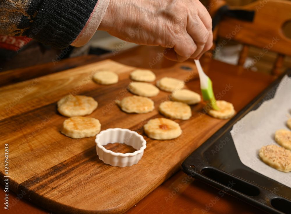 Baking cookies at home with careful attention to detail in a cozy kitchen)
