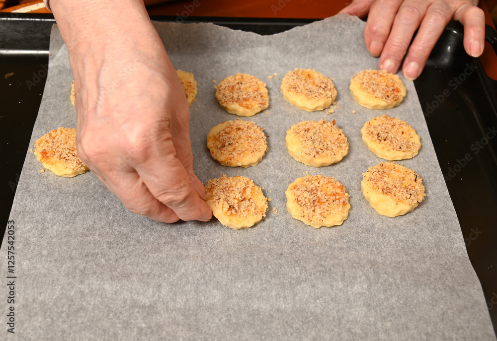 Baking delicious cookies with a homemade crumb topping in a cozy kitchen