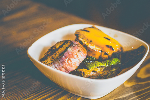 grilled eggplant, zuchini,bell peppers served in a whte bowl photo