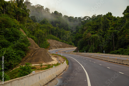 Road No. 4 Phetkasem Road from Phatthalung Province to Trang Province, passing through Khao Phap Pha, a mountain range and one of the most pristine forests in the South of Thailand photo