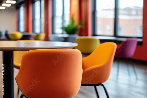 colorful chairs around a table in an office