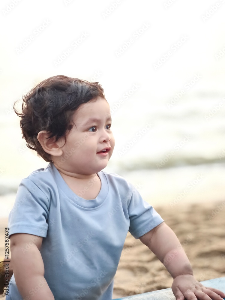 Cute innocent baby boy enjoying the beach and sea Cute innocent baby boy enjoying the beach and sea