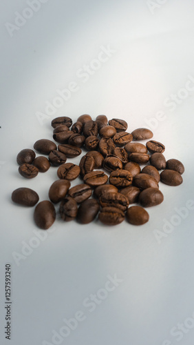  Roasted coffee beans are blackish brown, with a white background