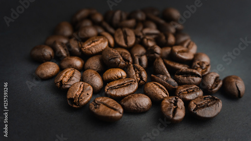  Roasted coffee beans are blackish brown, with a black background